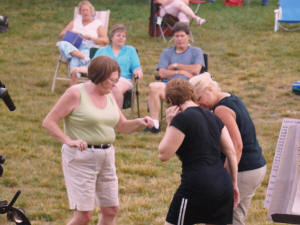A little soggy ground won't stop these die hard Oracle fans from dancing!